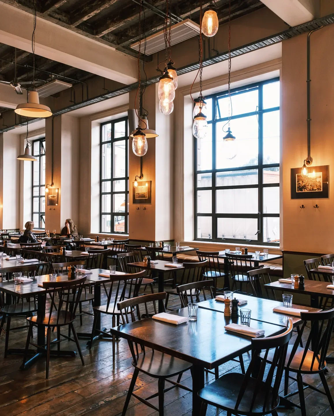 Interior of Charley Noble restaurant in Wellington, showcasing tables and lighting.