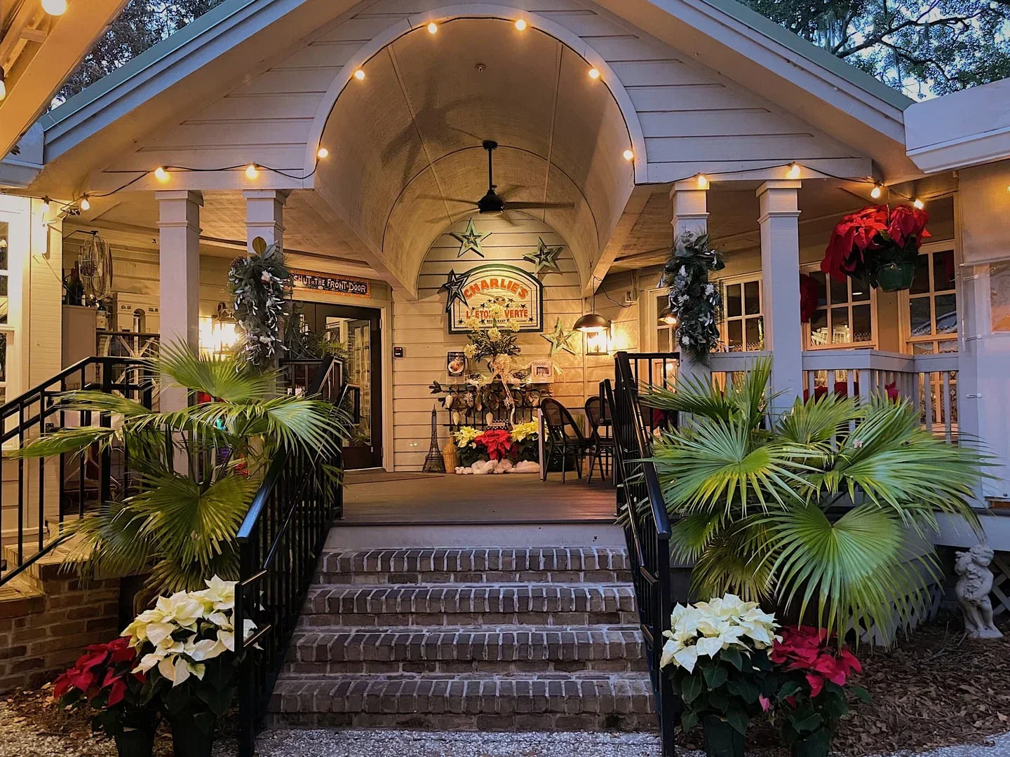 Charlies L’etoile Verte in Hilton Head Island, restaurant entrance with festive decor and lights