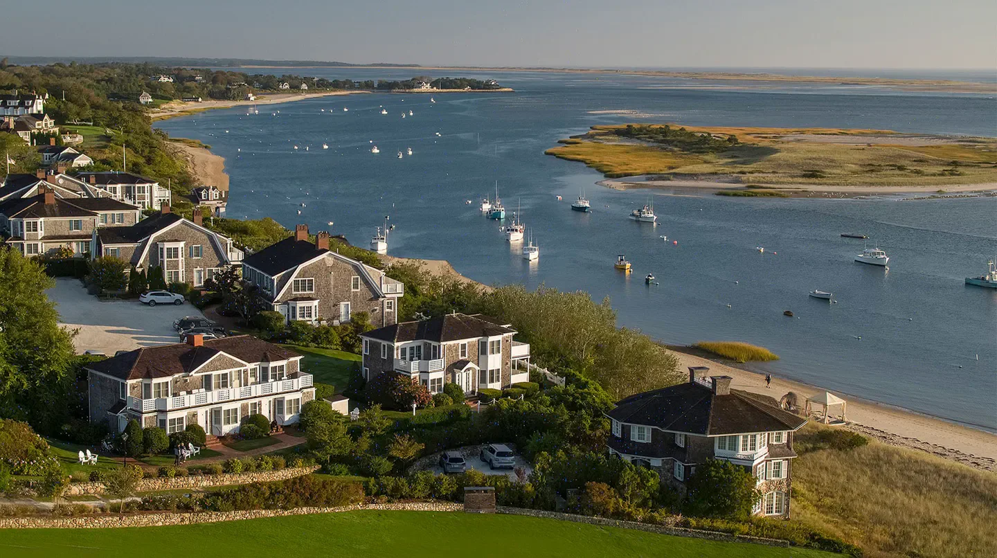 Coastal view of Chatham Bars Inn in Nantucket with waterfront homes and boats