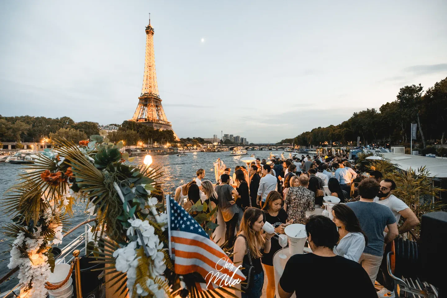 Chez Mila nightclub in Paris with Eiffel Tower view and evening party scene.
