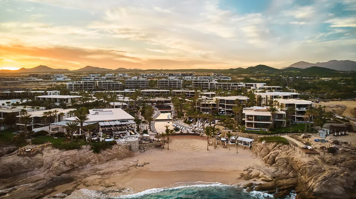 Aerial view of Chileno Bay Resort & Residences in Los Cabos, overlooking beach and ocean