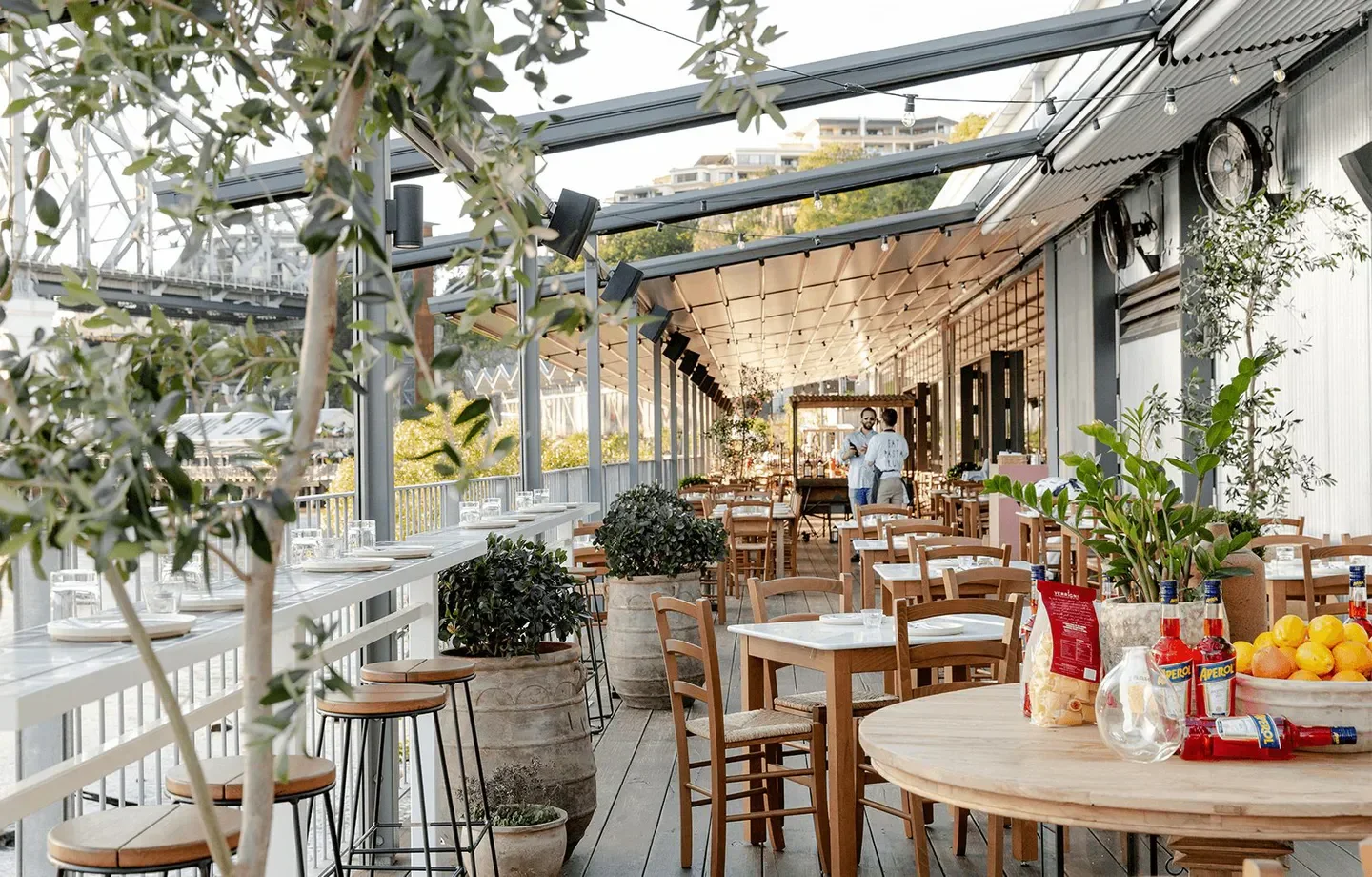 Outdoor dining at Ciao Papi Brisbane restaurant, with stylish decor and city views.