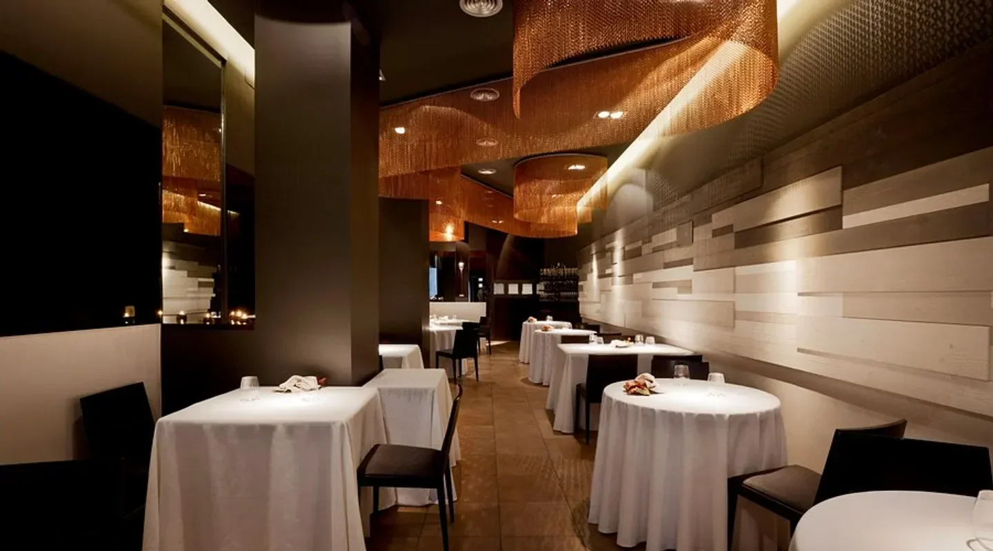 Elegant dining room interior at Cinc Sentits restaurant in Barcelona, with stylish decor.