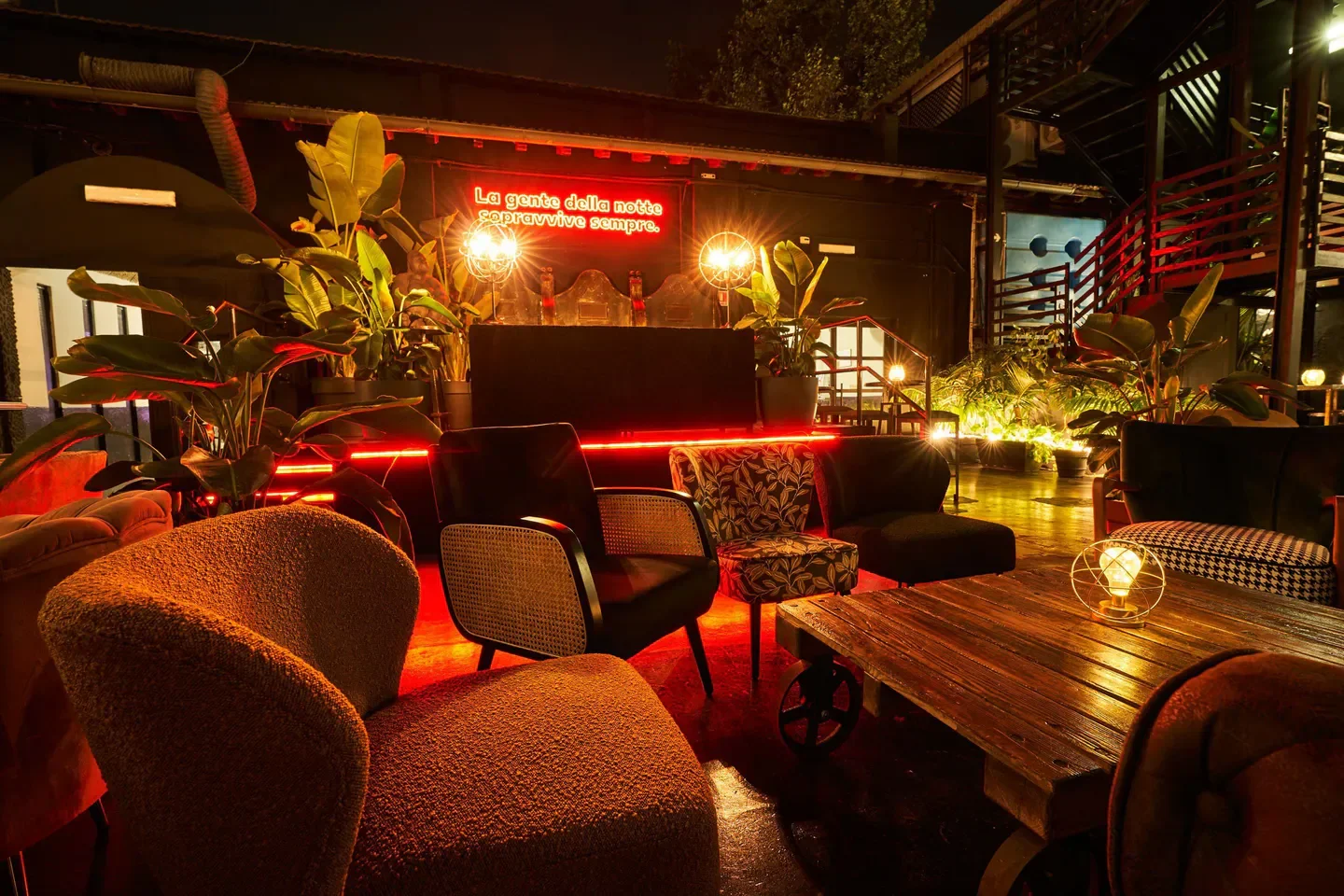 Cozy seating area at Circolo Degli Illuminati nightclub in Rome, Italy, at night.