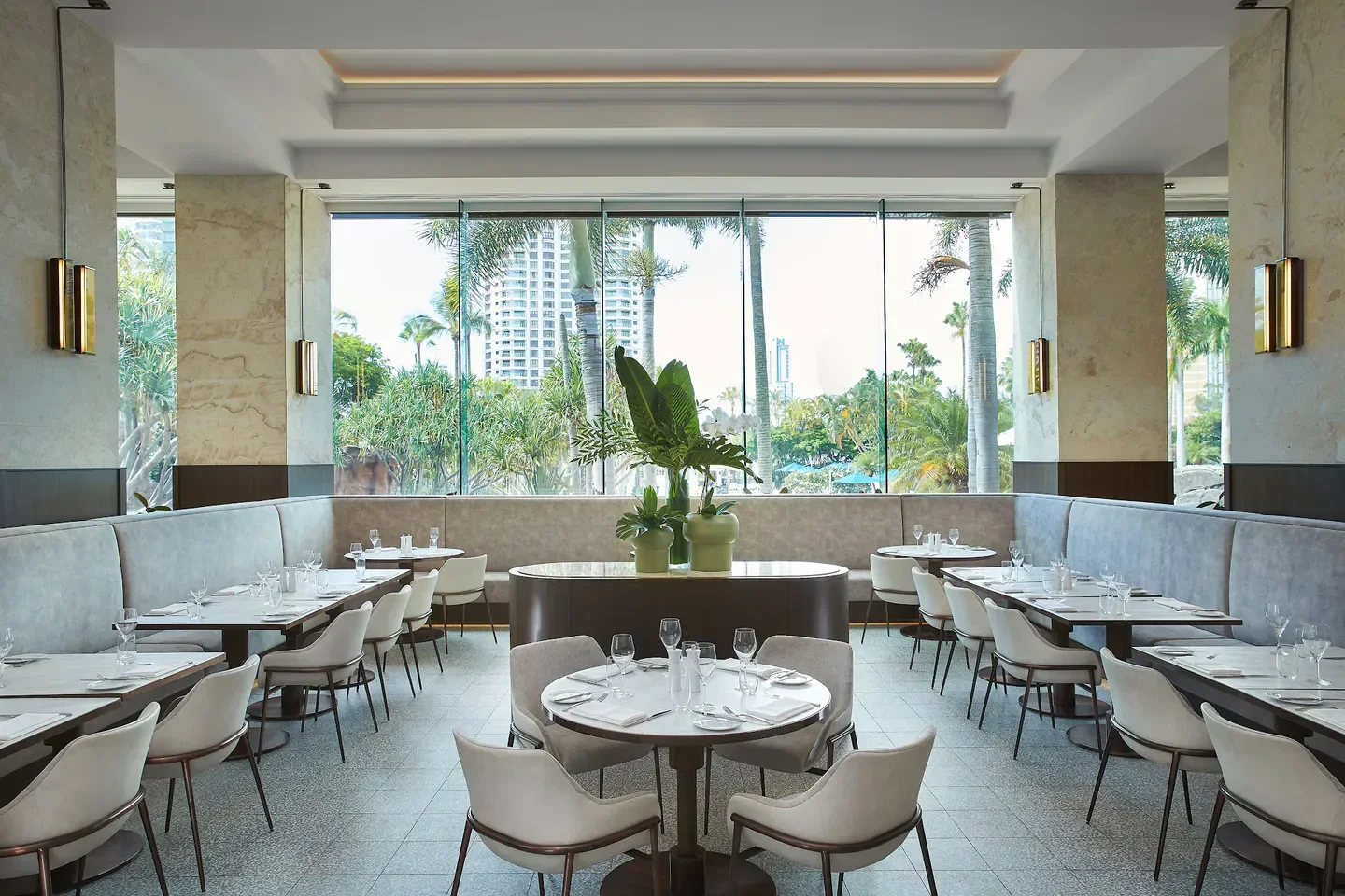 Citrique restaurant interior with tables, chairs, and a Gold Coast view through the window.