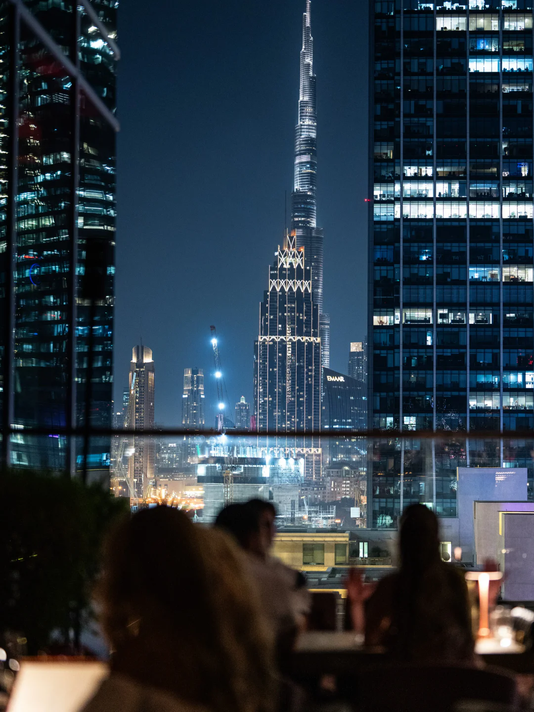 View of Dubai skyline and Burj Khalifa from Clap rooftop at night