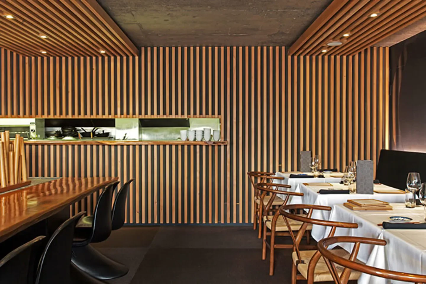 Cocoro Auckland's elegant interior with wooden slatted walls and tables ready for service.