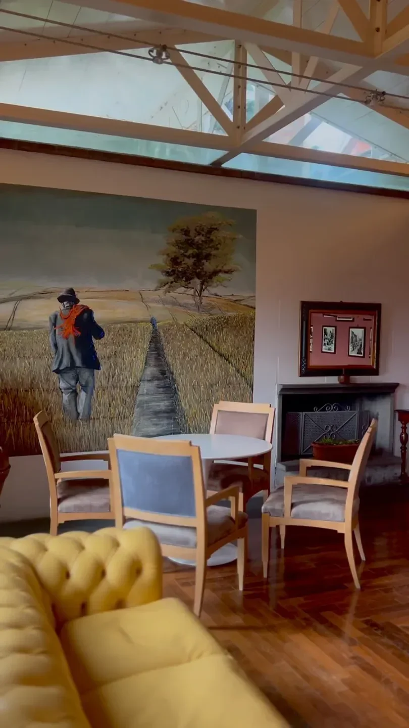 Interior of Colline Ciociare restaurant in Lazio, with art and seating area.