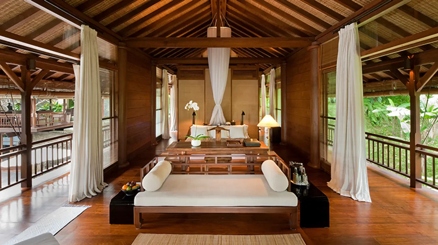 Luxury suite interior at COMO Shambhala Estate in Bali, featuring elegant wooden design