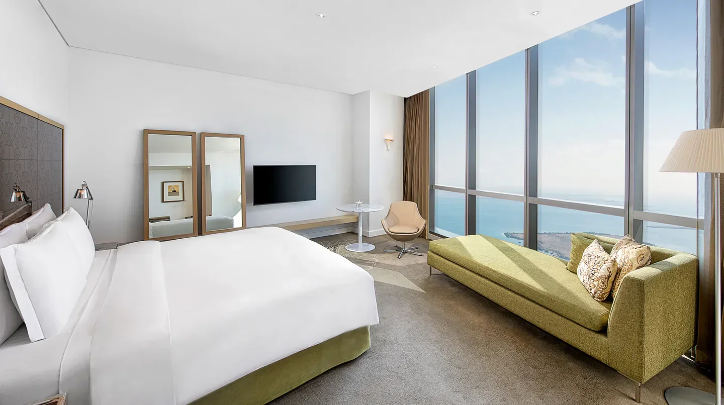 Spacious hotel room with ocean views at the Conrad Abu Dhabi Etihad Towers in Abu Dhabi.