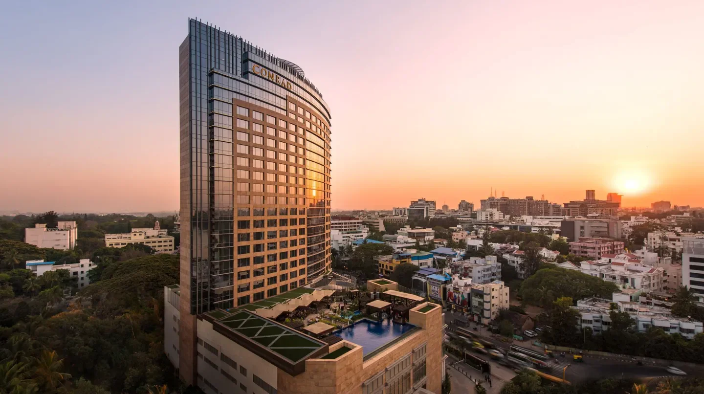 Conrad Bengaluru hotel at sunset with city views of Bengaluru