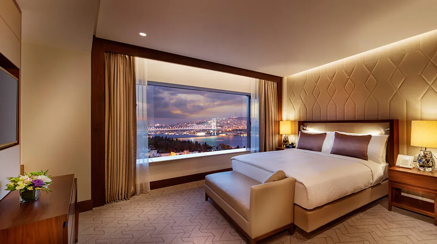 Conrad Istanbul Bosphorus hotel room with a beautiful view of Istanbul at dusk