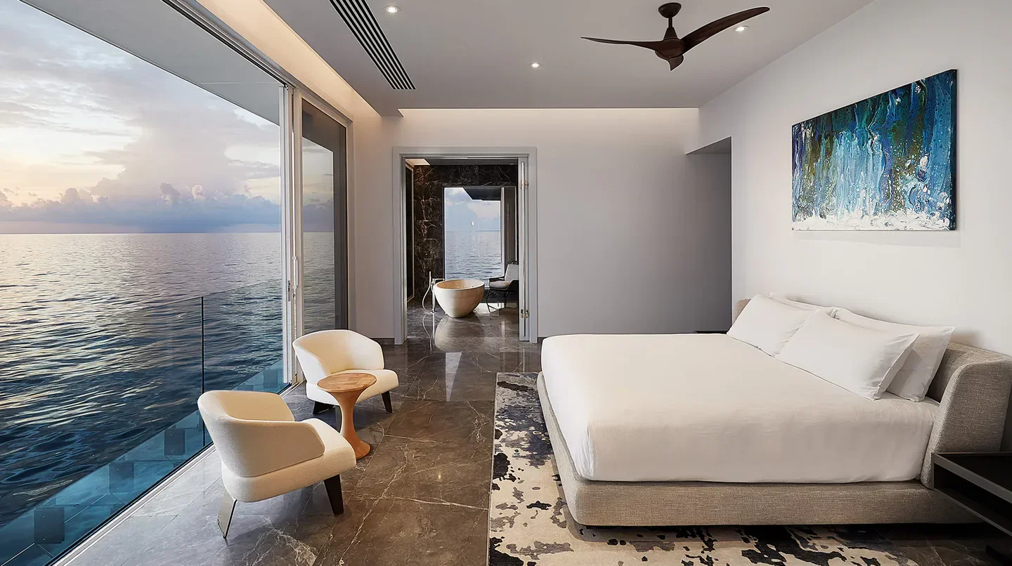 Luxury bedroom at Conrad Maldives Rangali Island, Maldives, with ocean views and a relaxing atmosphere.