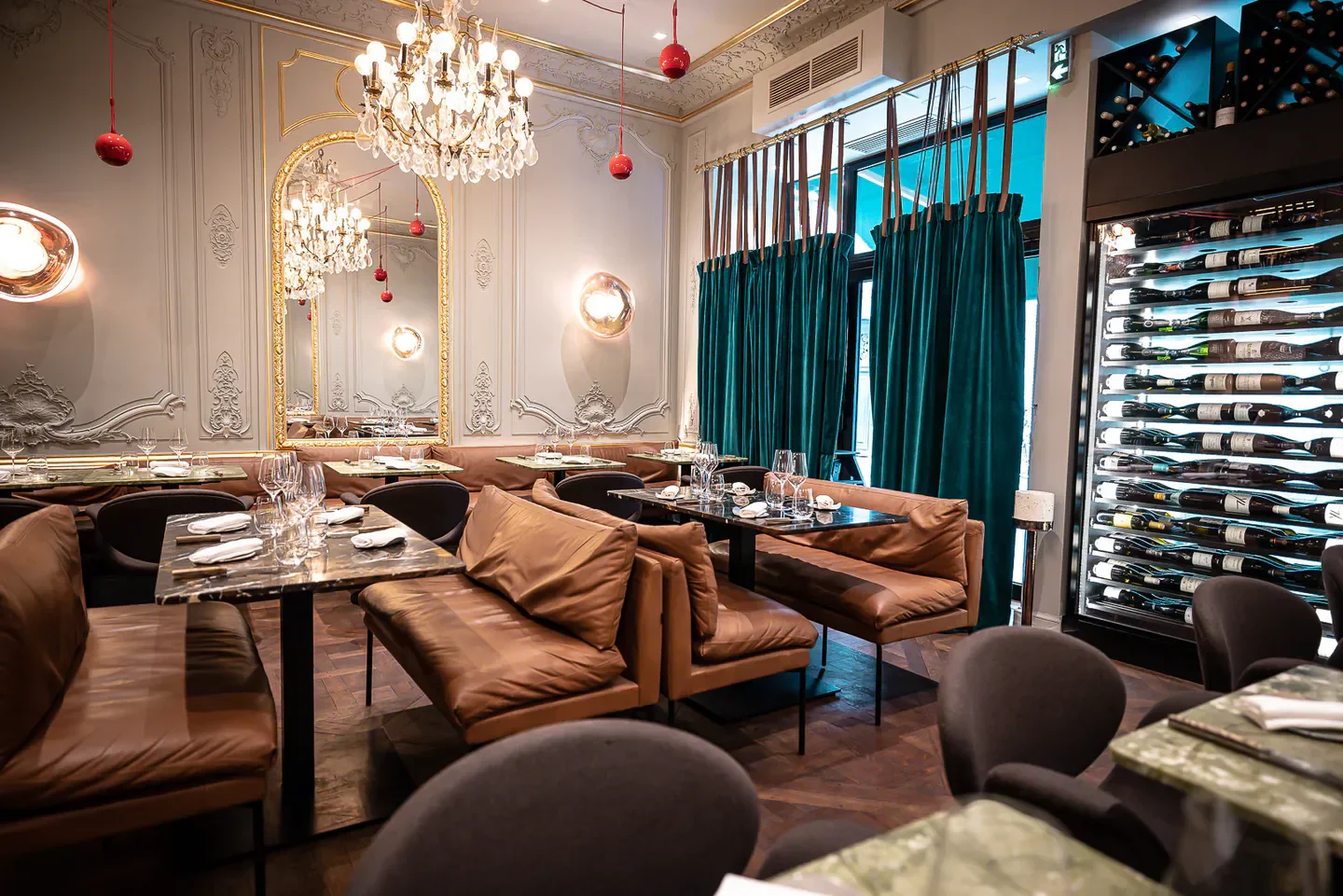 Elegant interior of Contraste restaurant in Paris, featuring stylish decor and wine display.