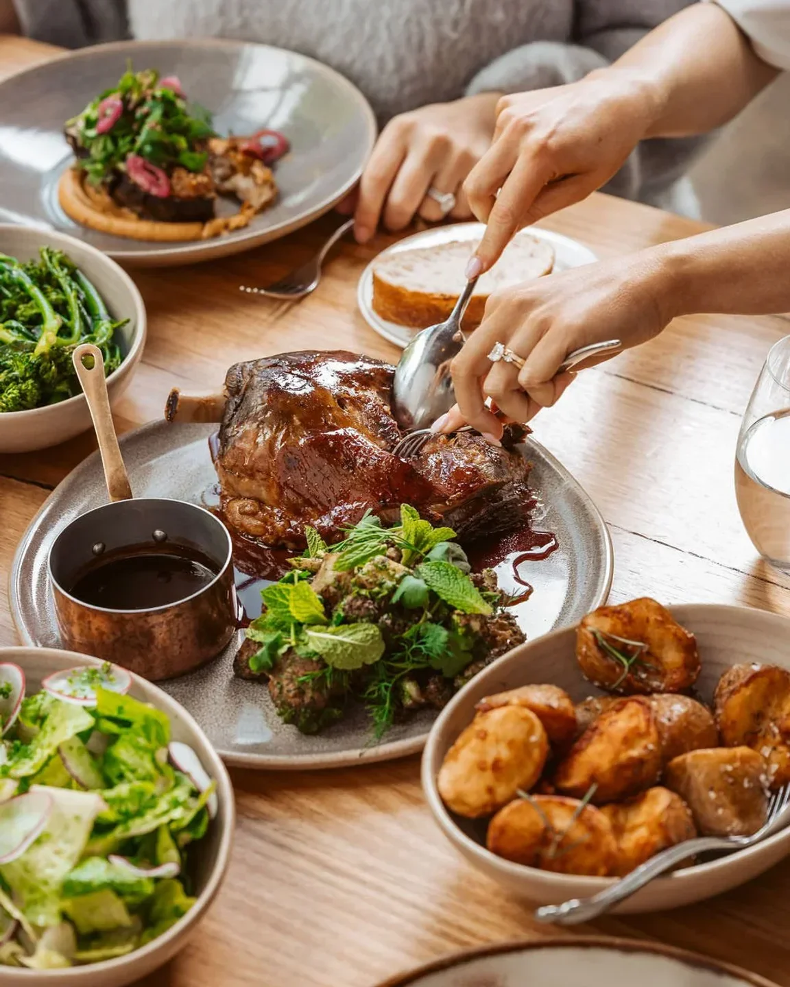 Delicious lamb dish at Coombe Yarra Valley restaurant in Yarra Valley, surrounded by sides