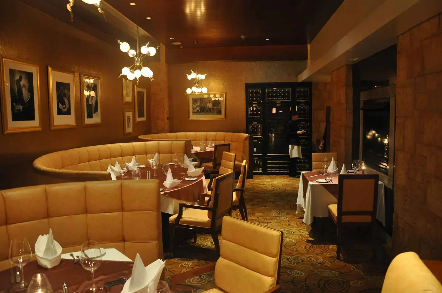 Cozy dining area at Copa Steakhouse in Macau, featuring elegant seating and warm lighting.