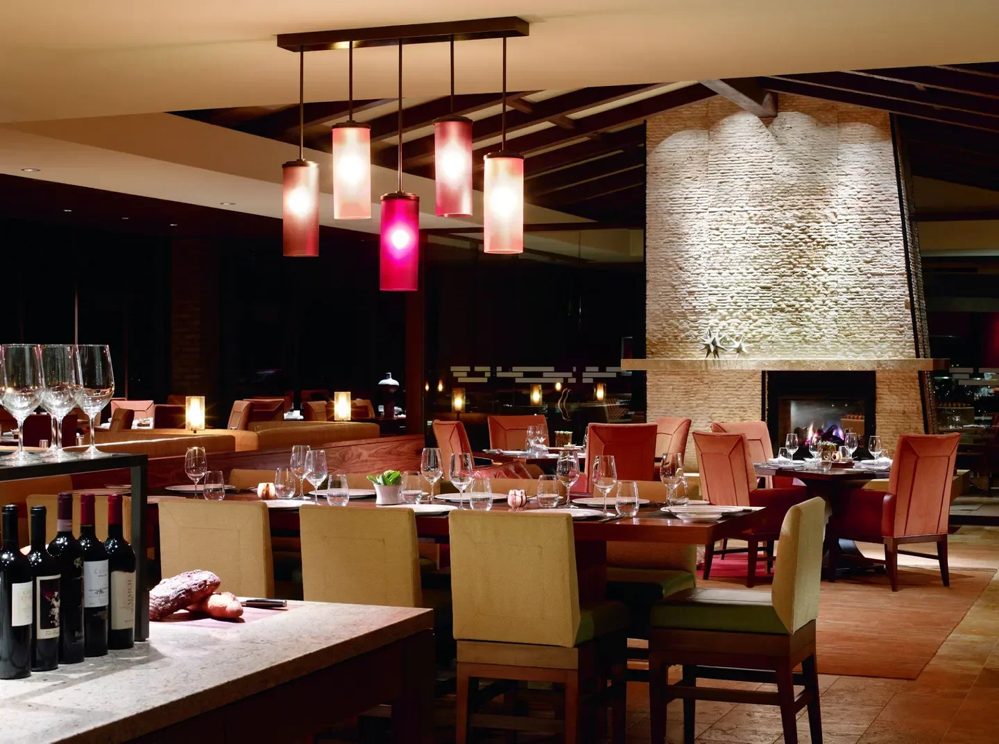 Cozy dining room at CORE Kitchen & Wine Bar in Virginia Beach with stylish lighting.
