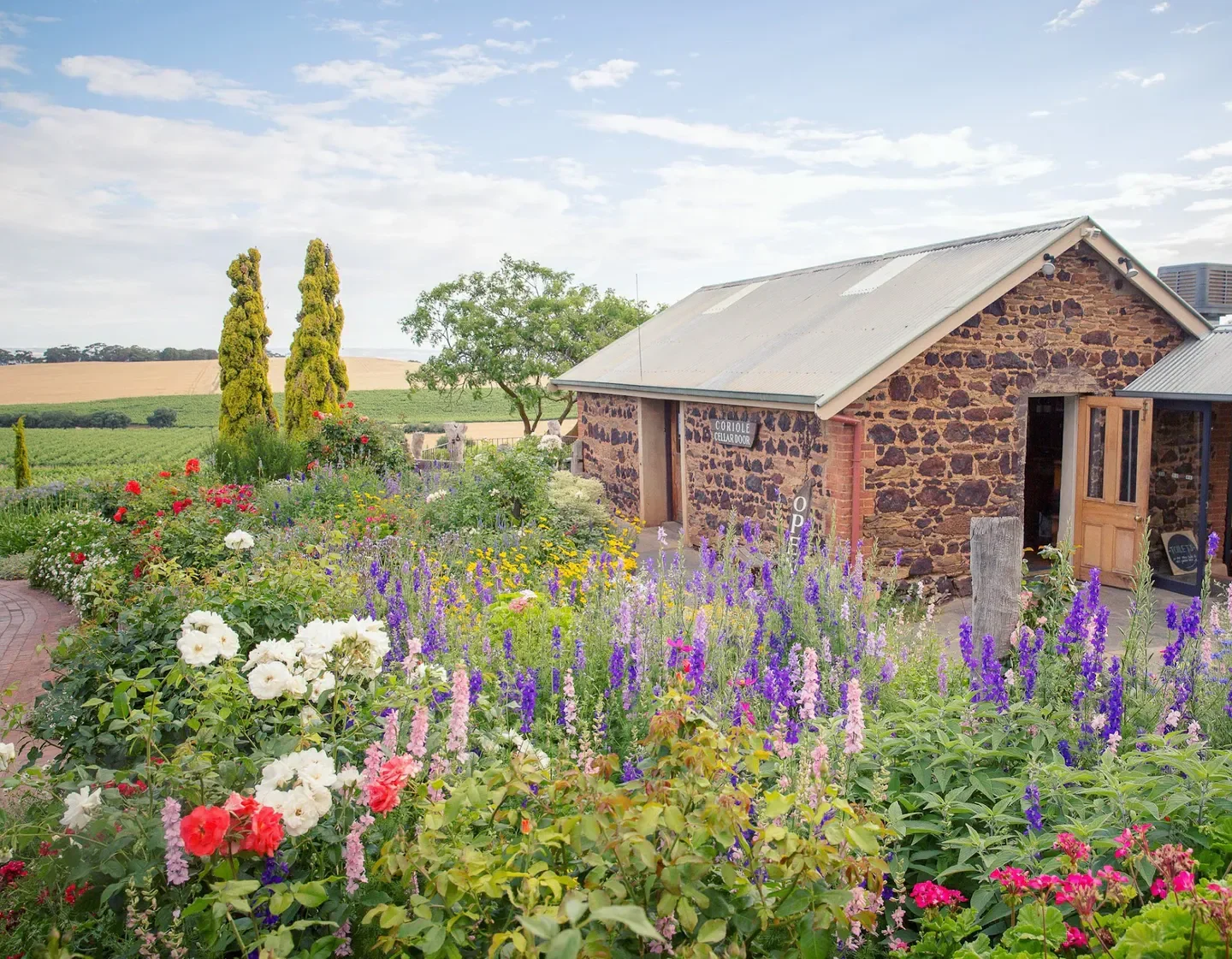 Exterior of Coriole Vineyards Restaurant in McLaren Vale and Fleurieu Coast, surrounded by flowers.