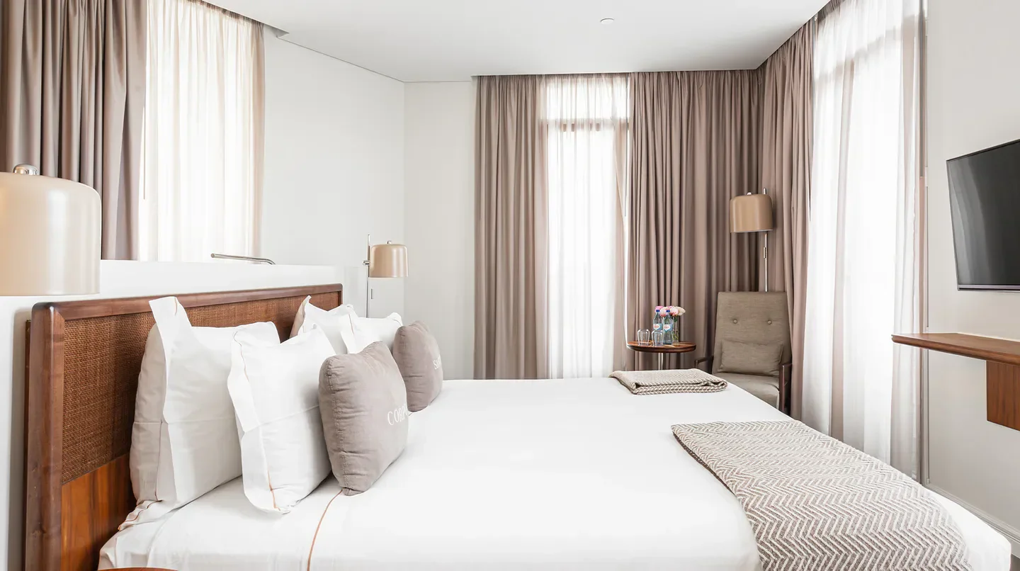 Cozy bedroom at Corpo Santo Lisbon Historical Hotel in Lisbon, with elegant design and decor.