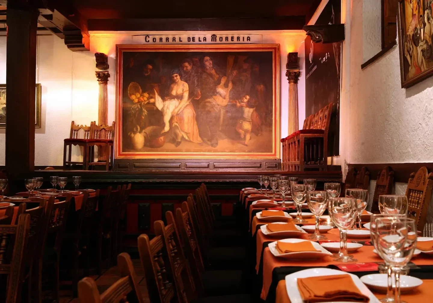 Interior of Corral de la Morería Gastronómico in Madrid, showcasing elegant dining setting.