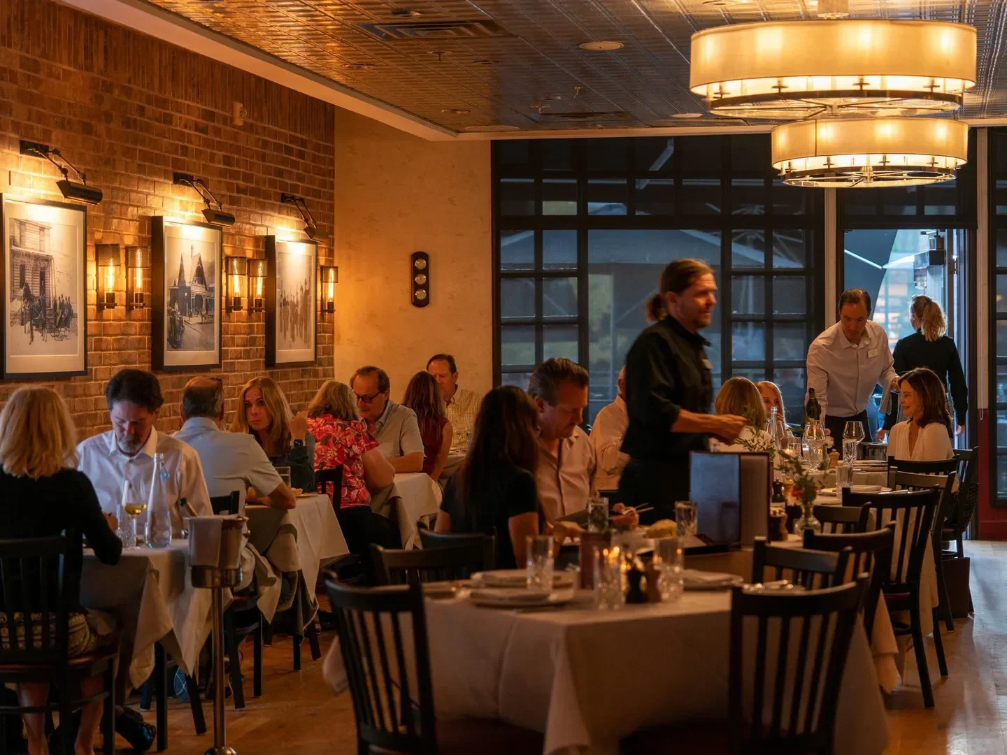 Interior of Courchevel Bistro in Park City, Utah, with diners and elegant decor