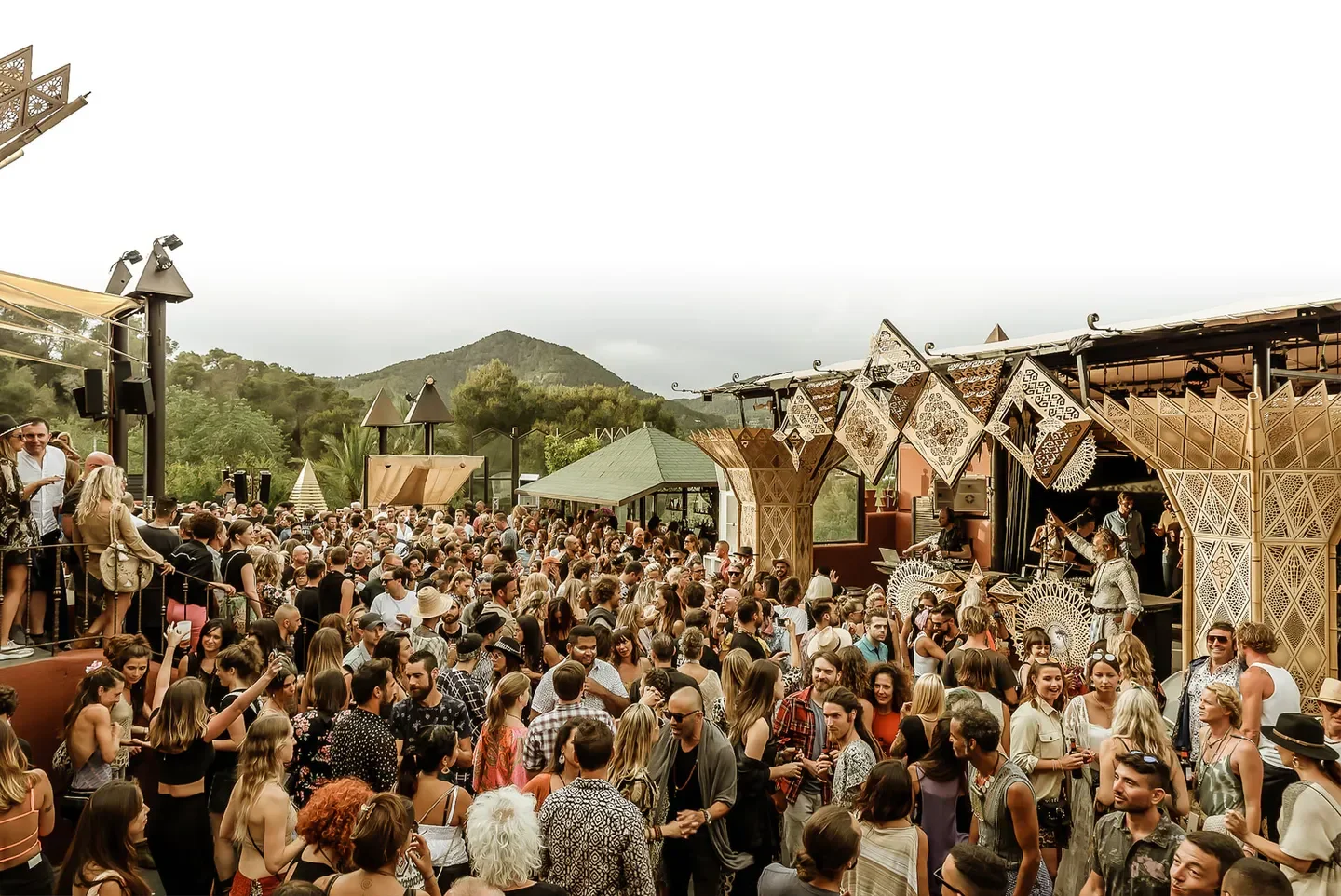 Cova Santa Ibiza: A lively crowd enjoying the beach club atmosphere with music and dance