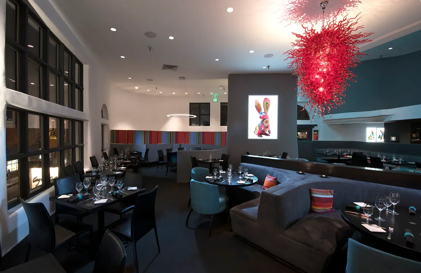 Interior of Coyote Cafe & Rooftop Cantina in Santa Fe with art and decor