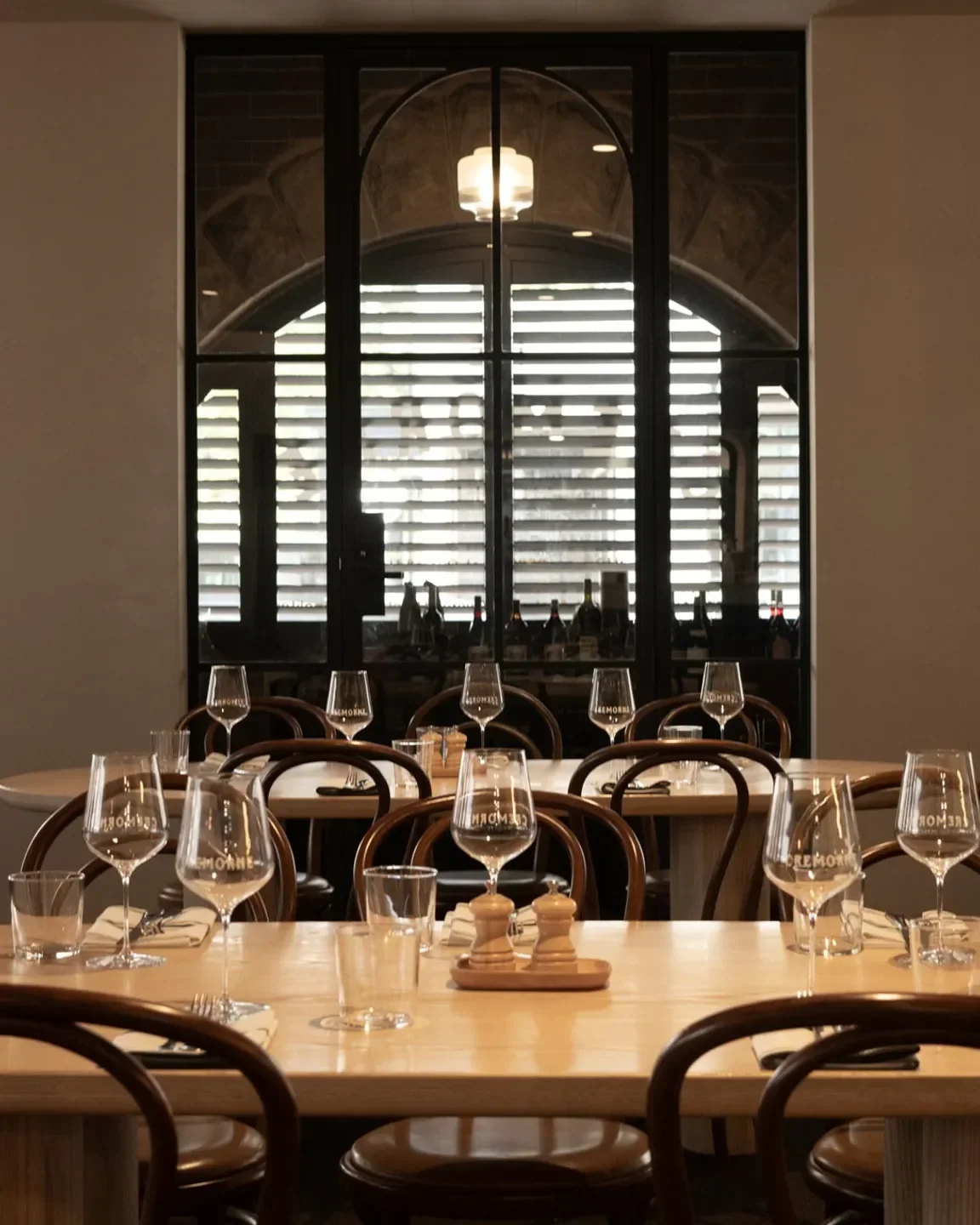 Dining area at Cremorne Hotel, Adelaide, with wine glasses set on tables.