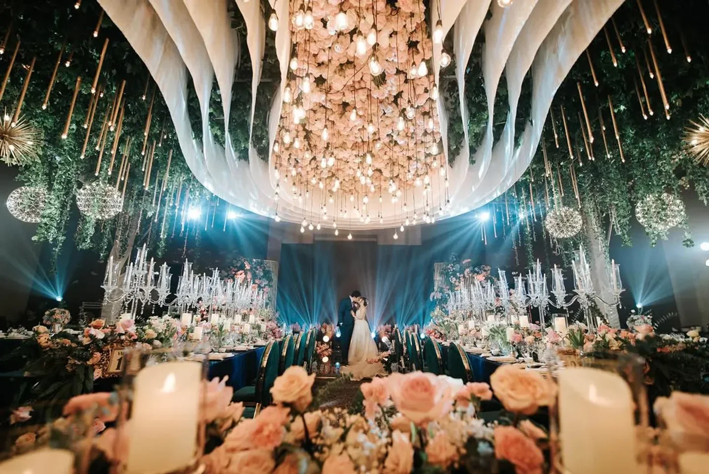 Elegant wedding reception at CRU Steakhouse in Manila, featuring floral decor and chandeliers.
