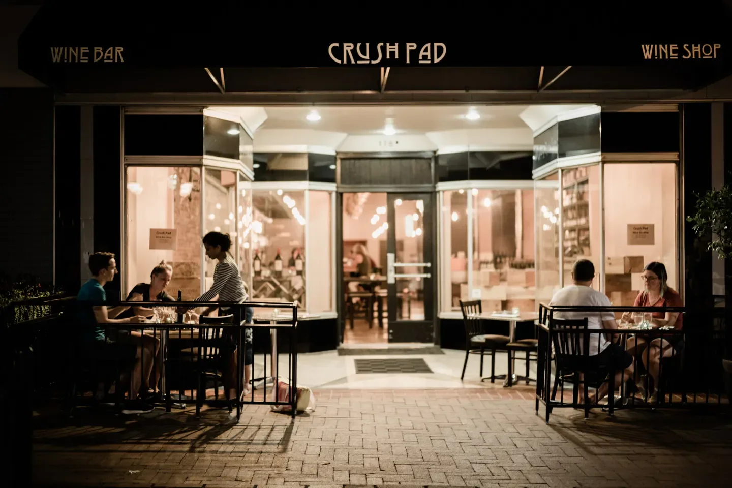 Exterior of Crush Pad Wines in Charlottesville, with patrons dining outdoors.