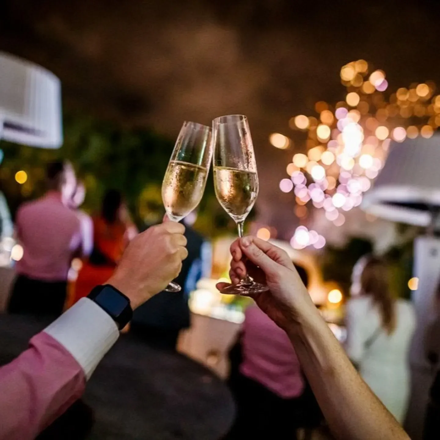 Cheers at Cucina Vivo Gold Coast with champagne flutes, celebrating with friends.