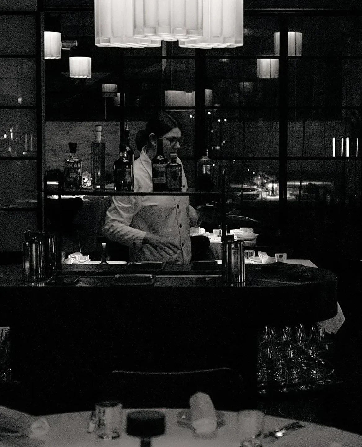 Interior of Cutler restaurant in Melbourne, a bartender preparing a drink.
