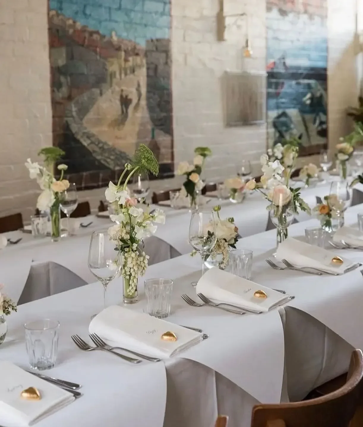 Elegant dining at Da Noi Melbourne, featuring floral centerpieces and a refined atmosphere.