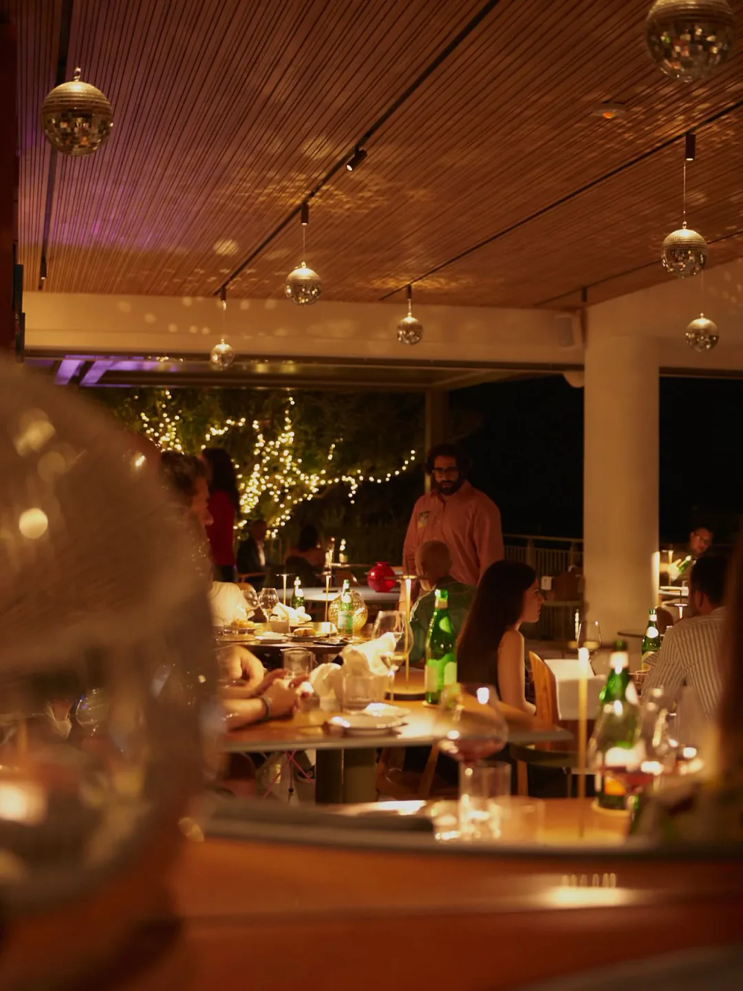 Cozy ambiance at Dalla Gioconda restaurant in Marche, Italy, with warm lighting and elegant decor for a memorable dining experience.