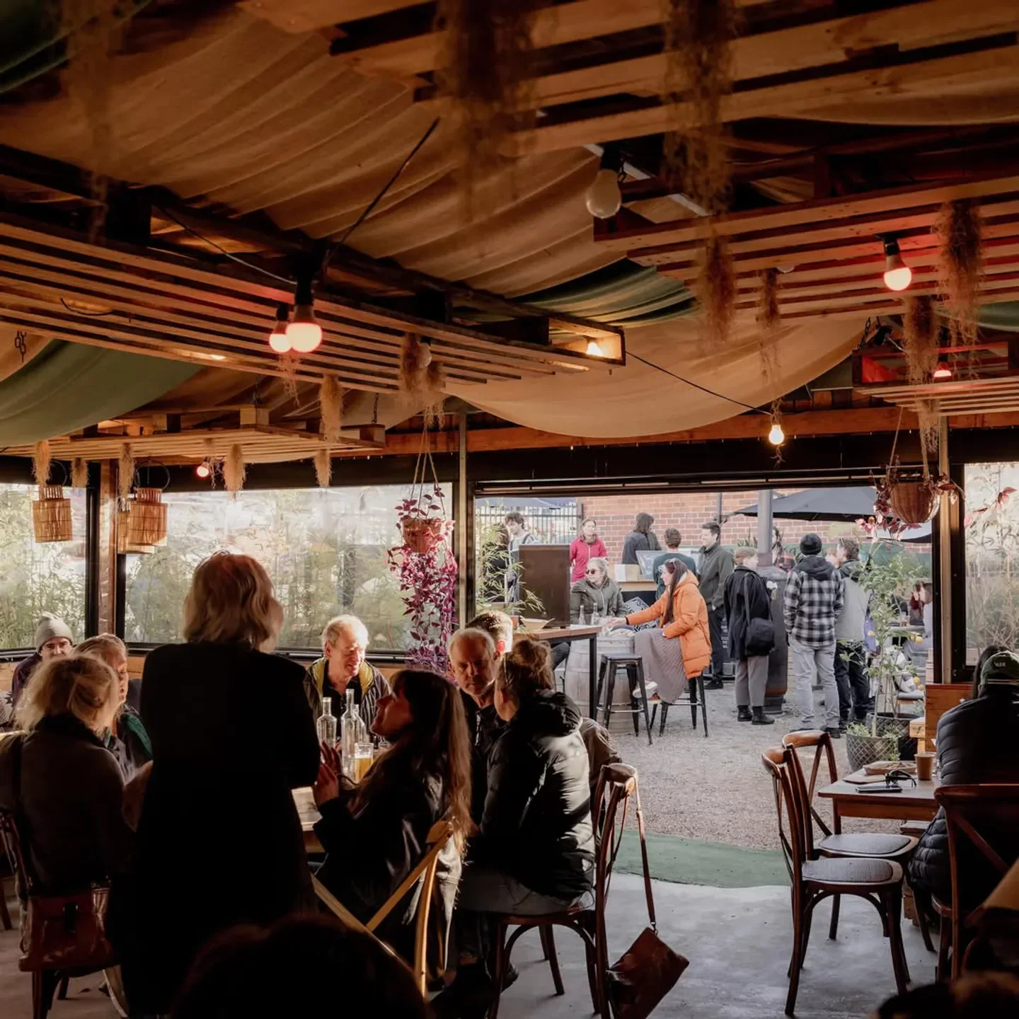 Patrons enjoying the atmosphere at Dāna Eating House, a restaurant in Hobart.