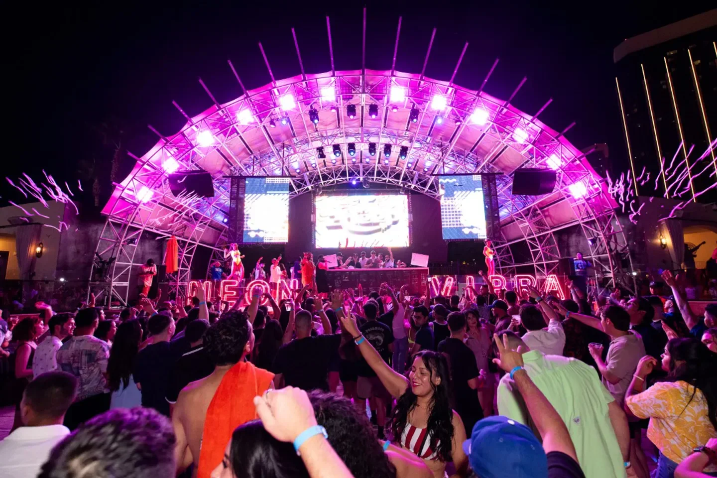 Daylight Beach Club Las Vegas nightlife: Party with neon lights and a cheering crowd.