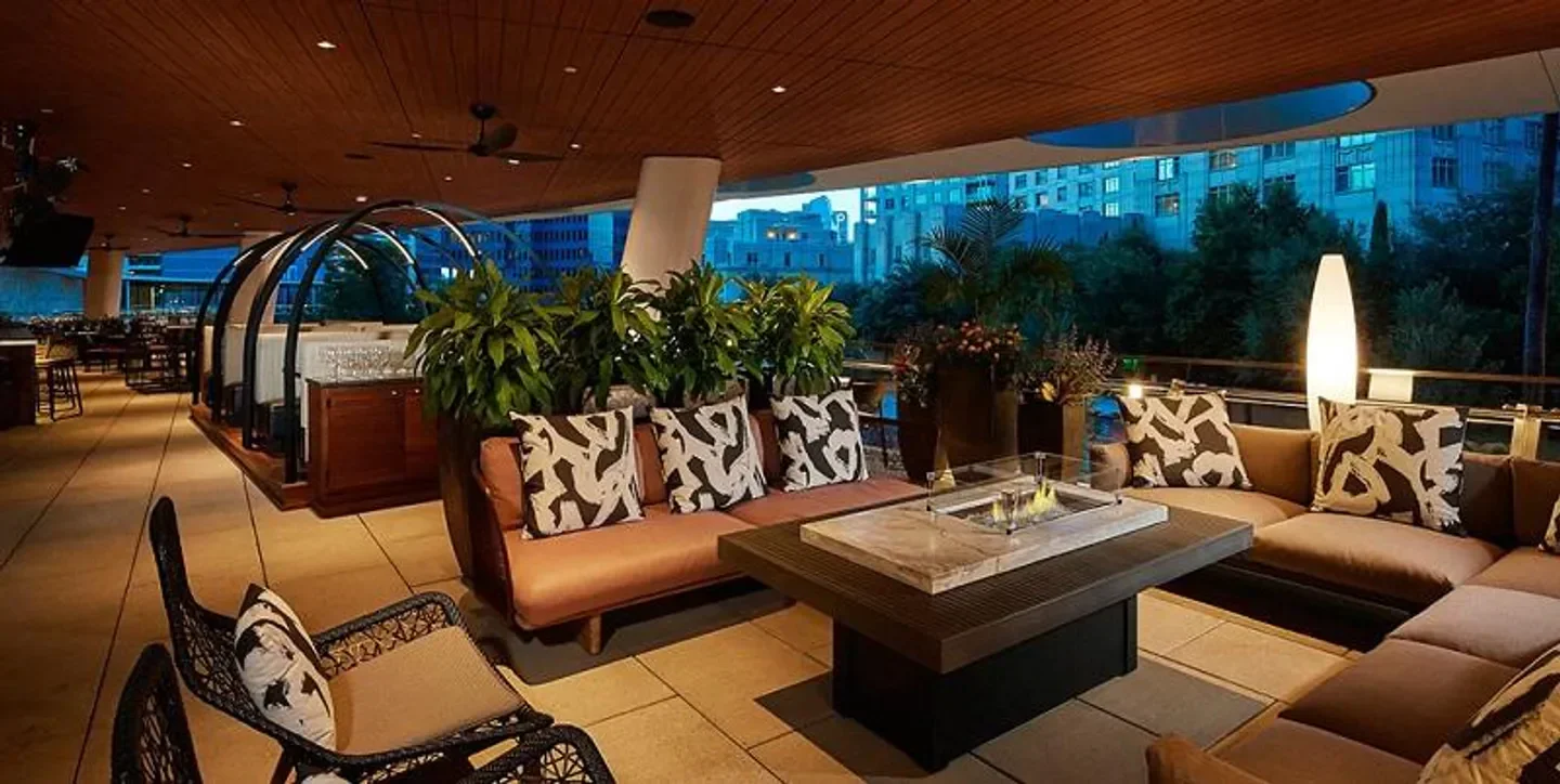 Outdoor seating at Del Frisco's Double Eagle Steakhouse - Dallas, in Dallas, with city views.