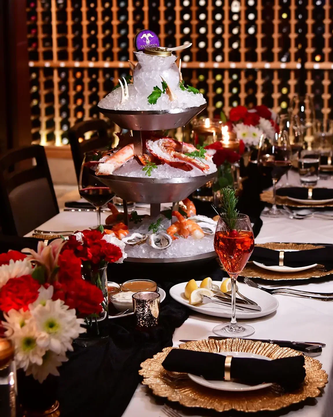 Seafood tower at Del Frisco's Double Eagle Steakhouse - Denver, with elegant table setting in Denver.