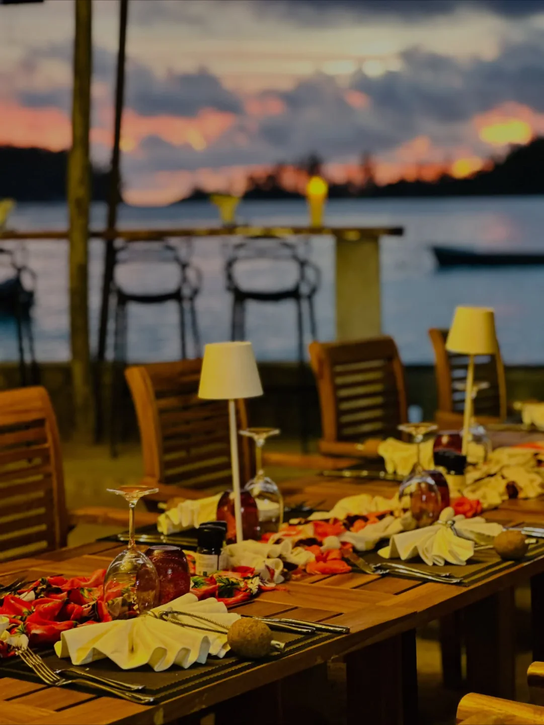 Romantic dinner setting at Del Place Restaurant in Victoria, Indian Ocean, with sunset view, ambiance
