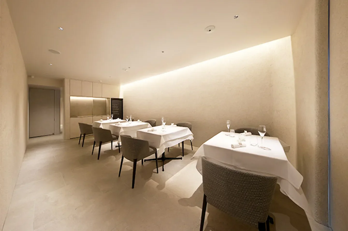 Interior of Différence restaurant in Osaka, showcasing elegant dining tables and chairs