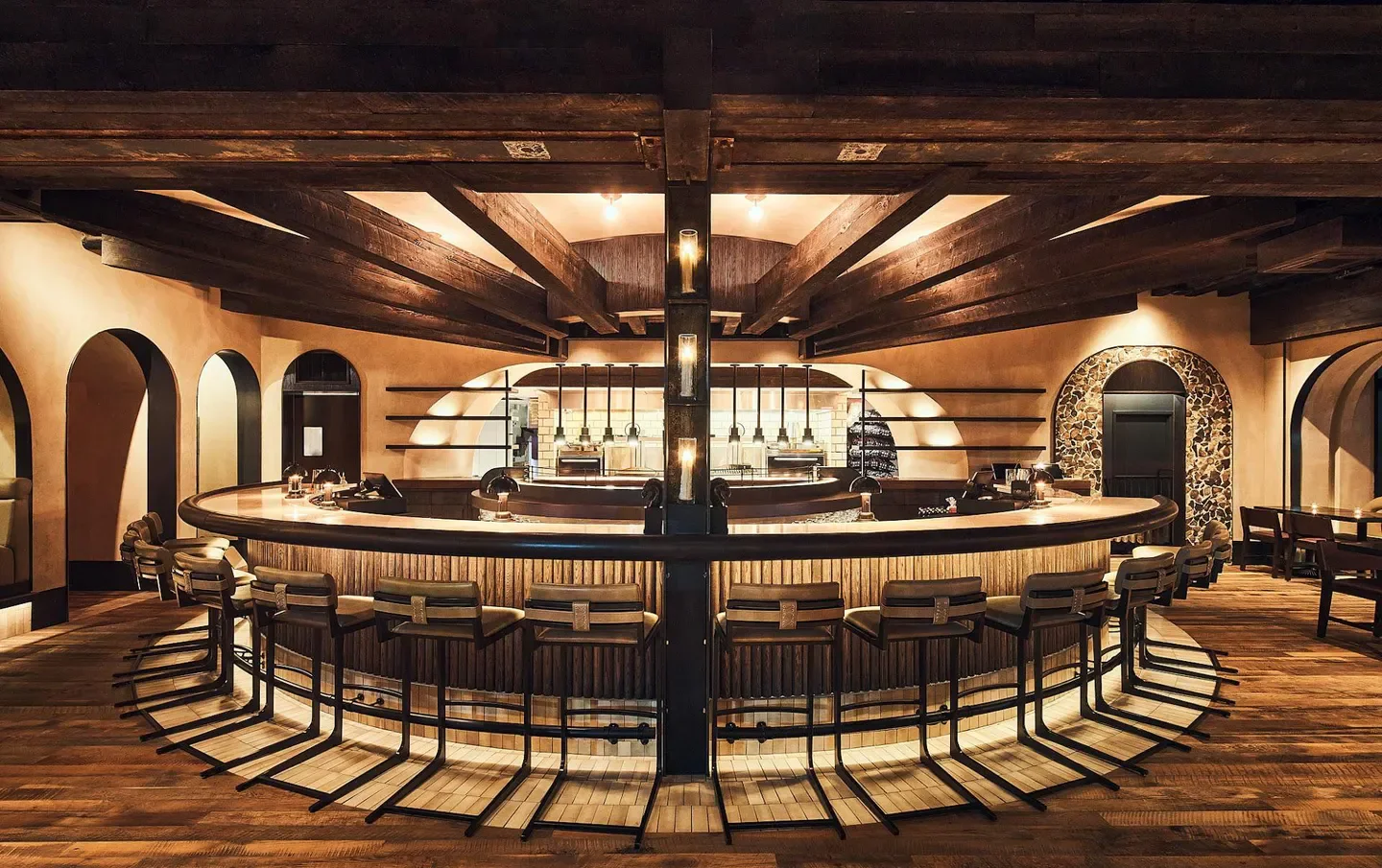 Interior of dLeña in Washington, with a beautiful bar and wooden beams.