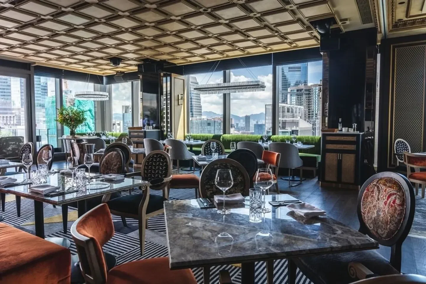 Elegant interior of Don Julio restaurant in Buenos Aires with city views.