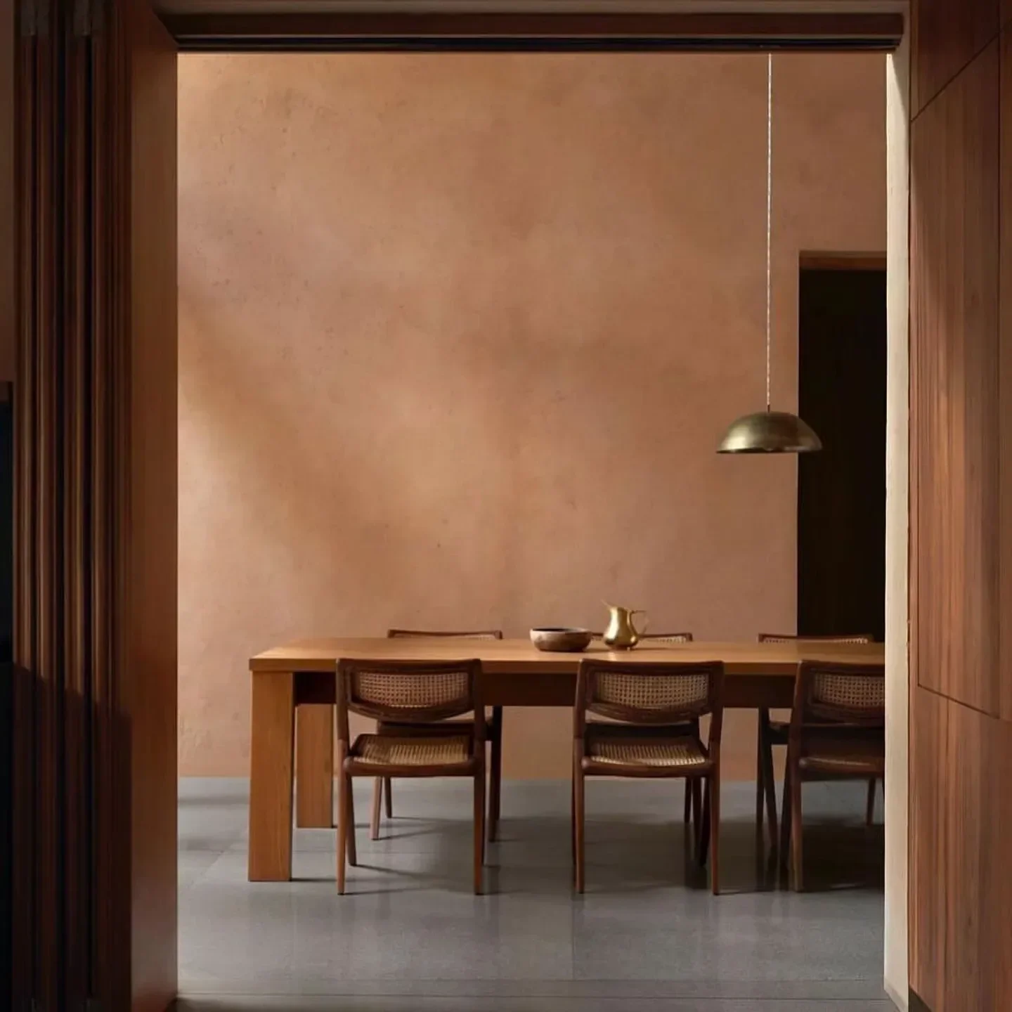 Doppo Kyoto restaurant dining room with wooden table and chairs, warm inviting space.