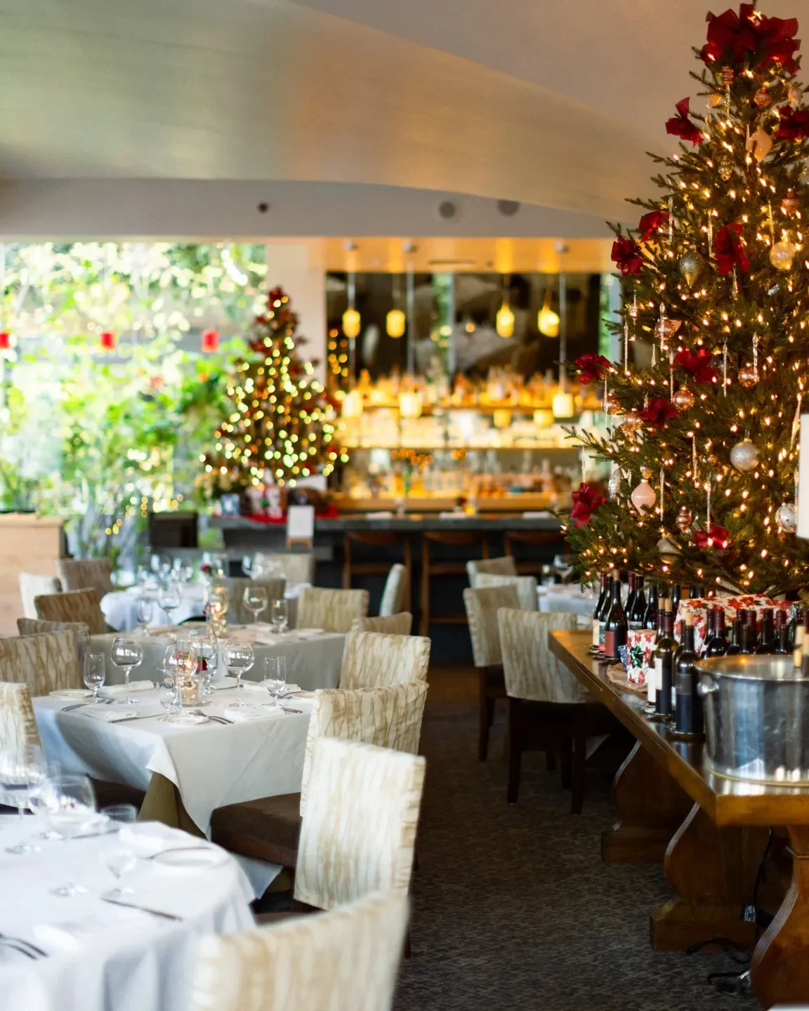Festive interior of Dry Creek Kitchen in Healdsburg, decorated for the holidays with Christmas trees.