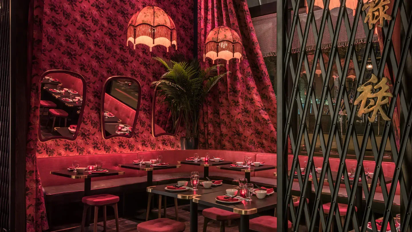 Duck Duck Goat restaurant in Chicago: stylish red interior with Asian-inspired decor.