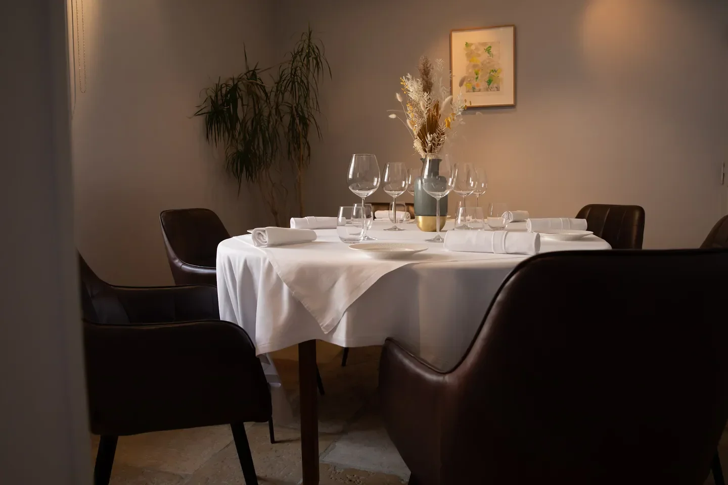 Elegant dining at Ed.Em restaurant in Bourgogne, featuring a table setting.