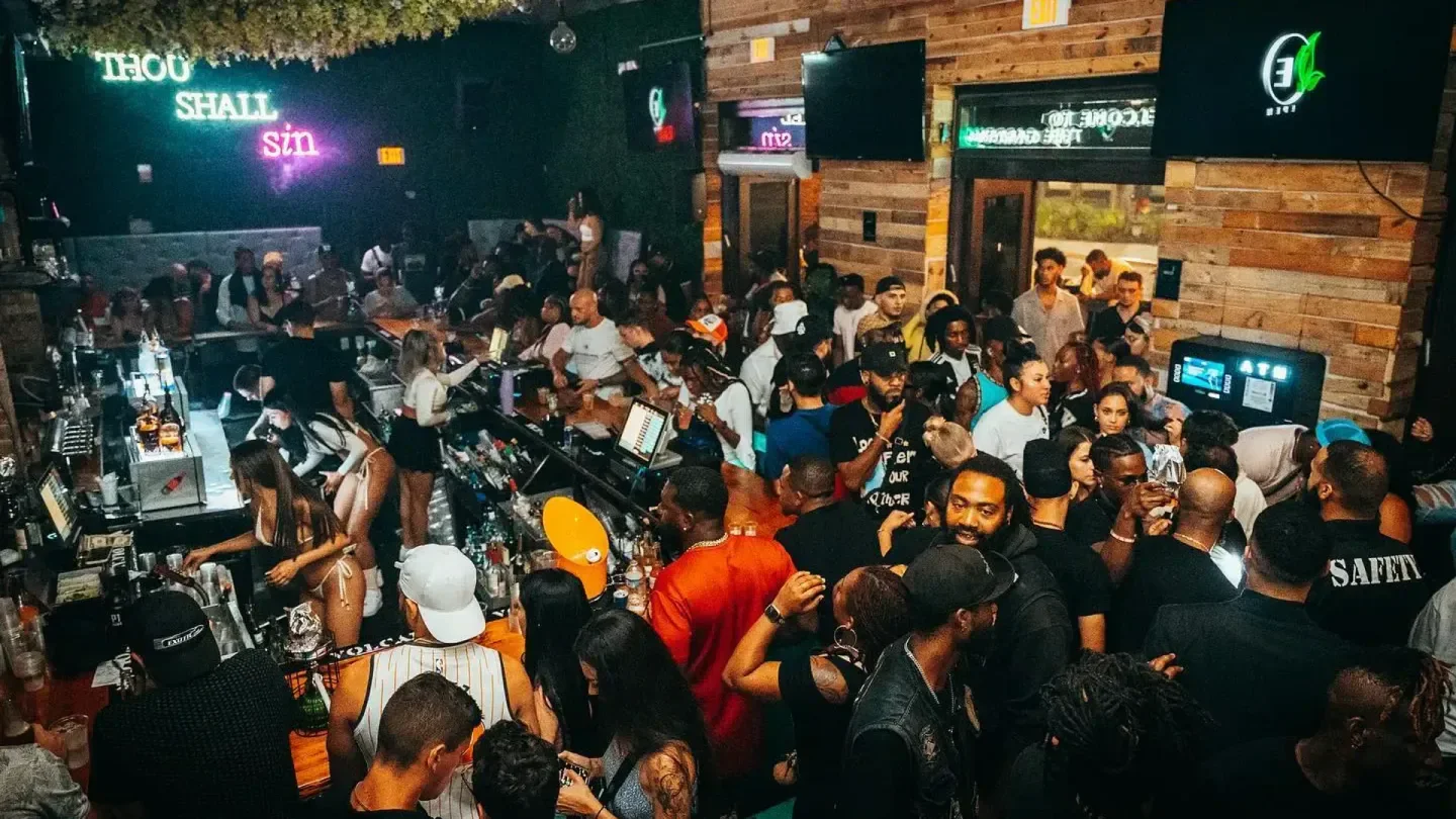 Energetic nightlife scene inside Eden nightclub in Orlando, with a crowd and bar scene.