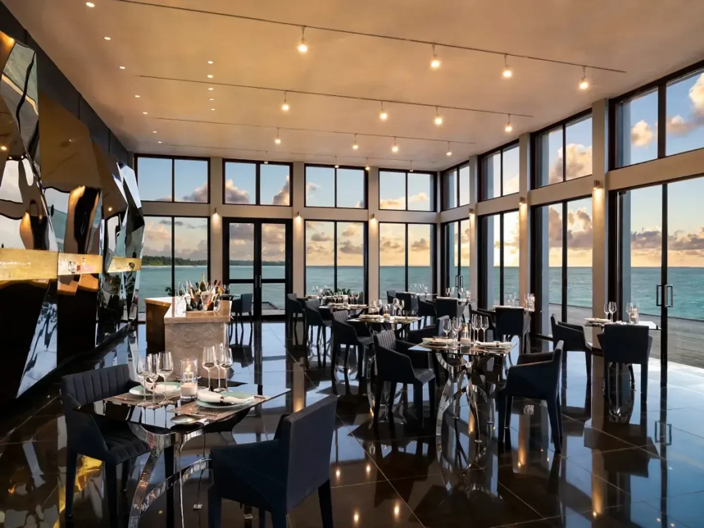 Dining at Edge restaurant in the Maldives, featuring stunning ocean views from the tables.