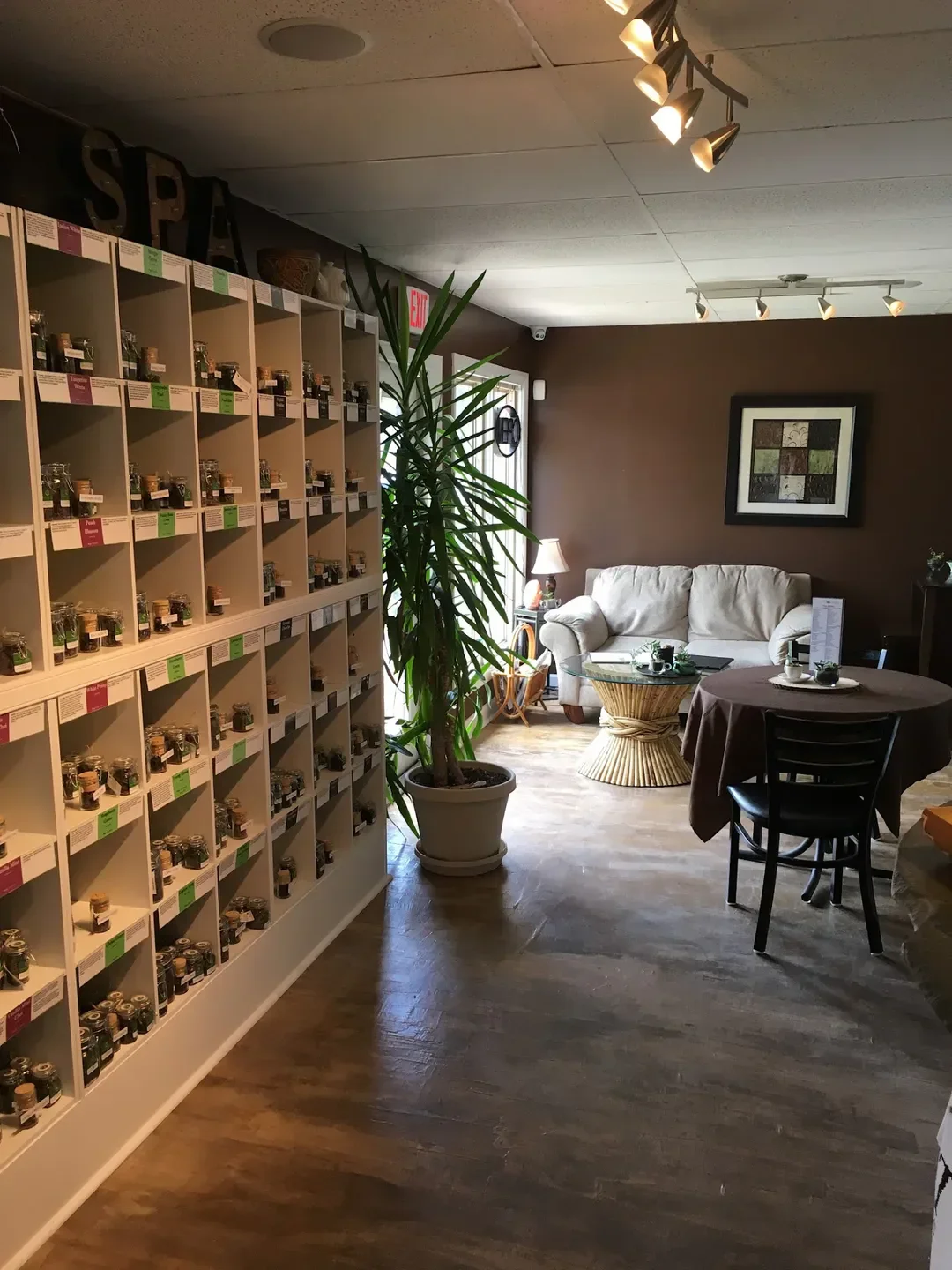 Interior of Edge Spa in Virginia Beach, with shelves of products and seating area.