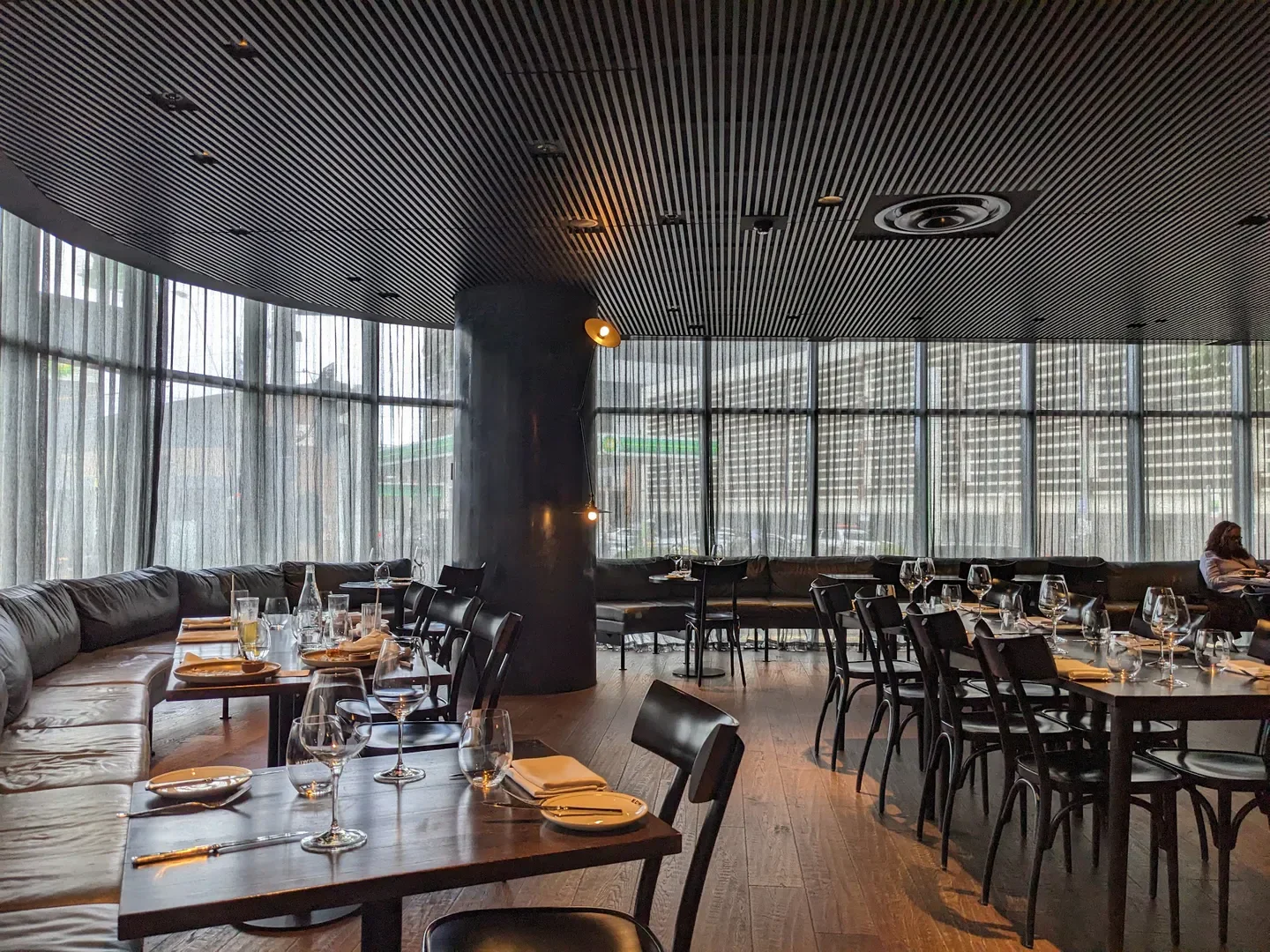 Interior of Edwin Wine Bar & Cellar in Melbourne, with tables set for dining.
